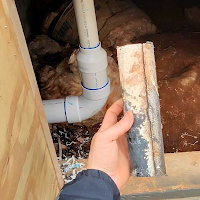 PVC drain pipe repair in crawlspace